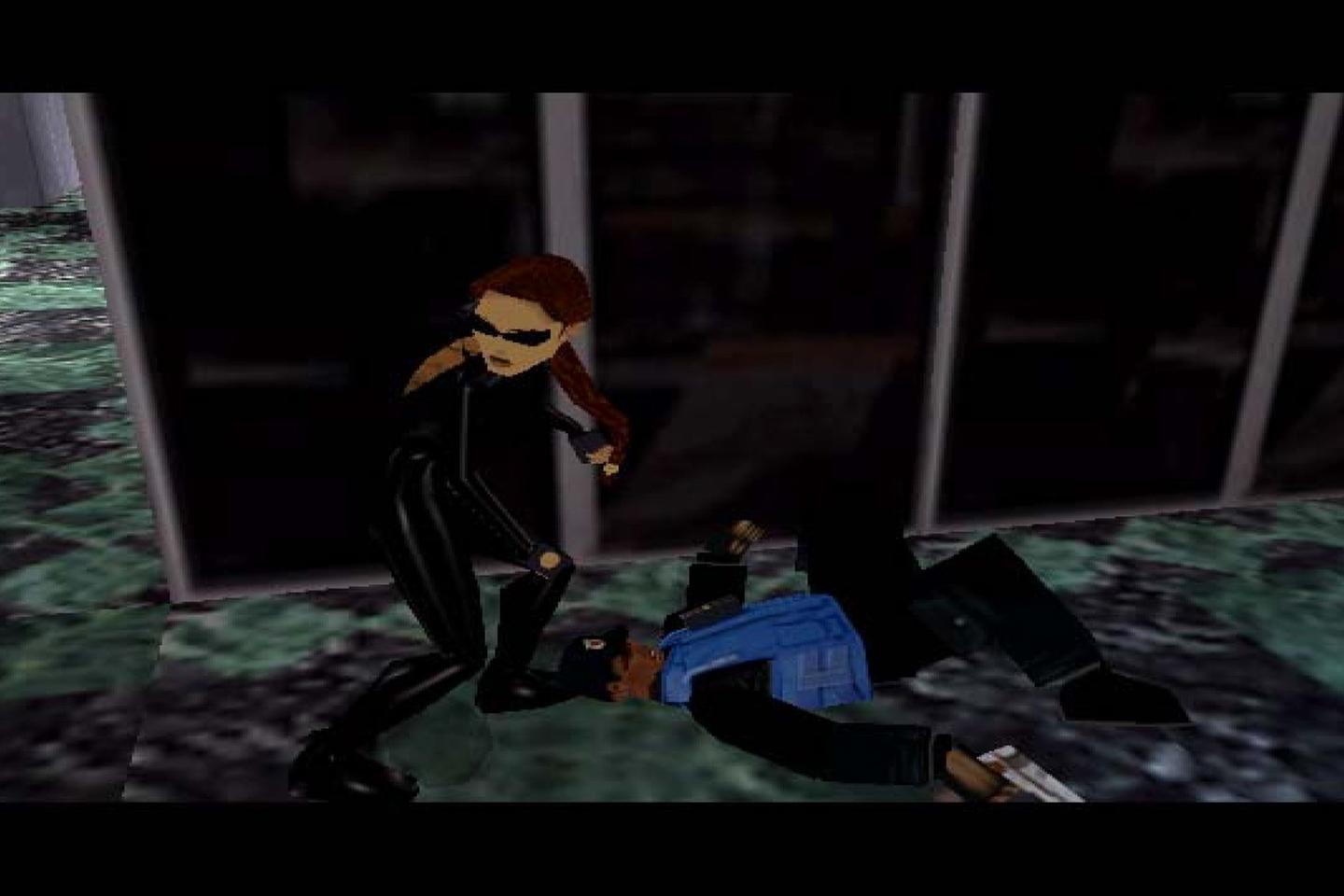 Lara standing over security guard holding gun.